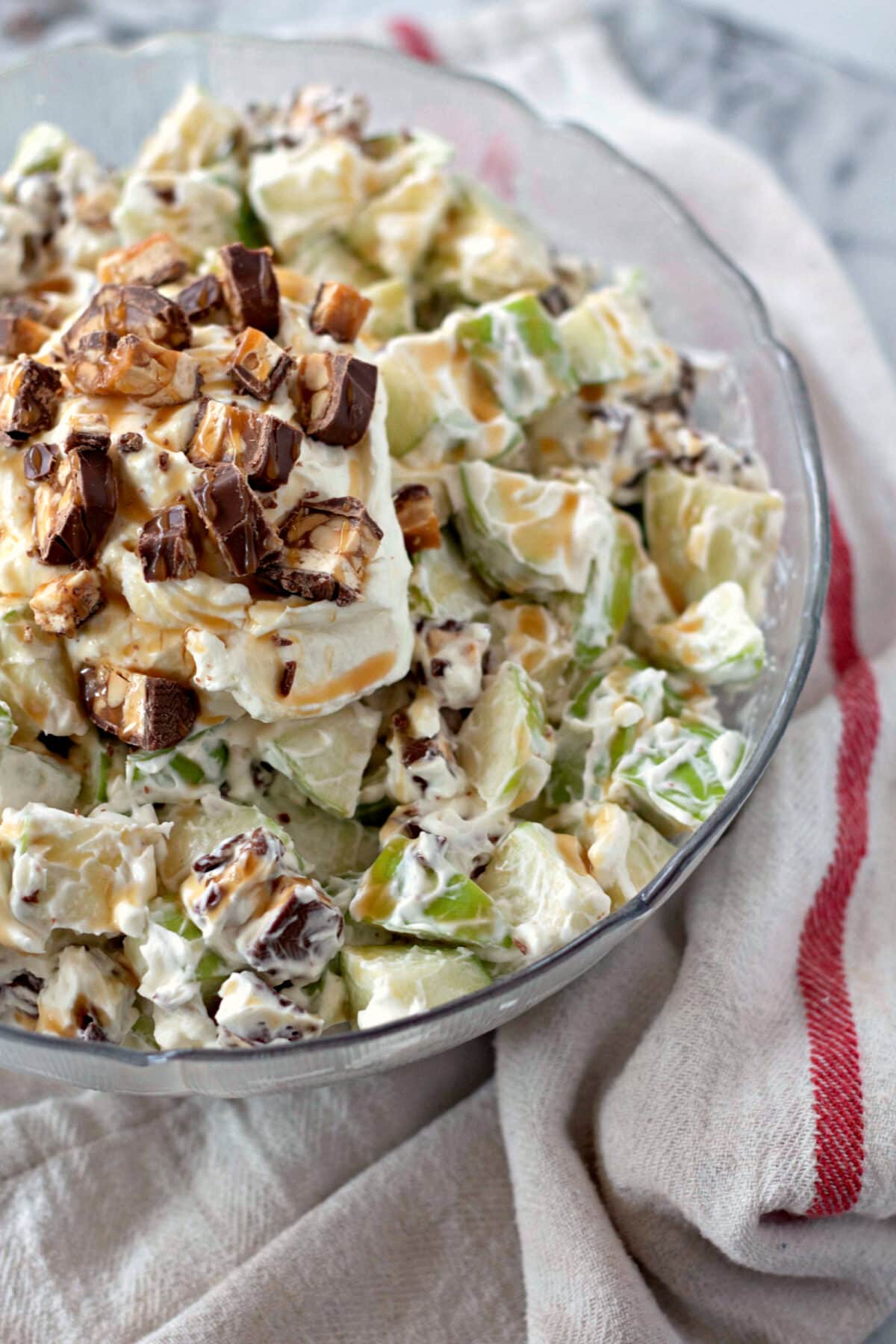 Snicker Salad with Apples, Caramel, Cream Cheese and Snickers Candy Bars