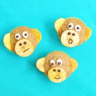 banana nut muffins that look like monkeys on a blue cloth