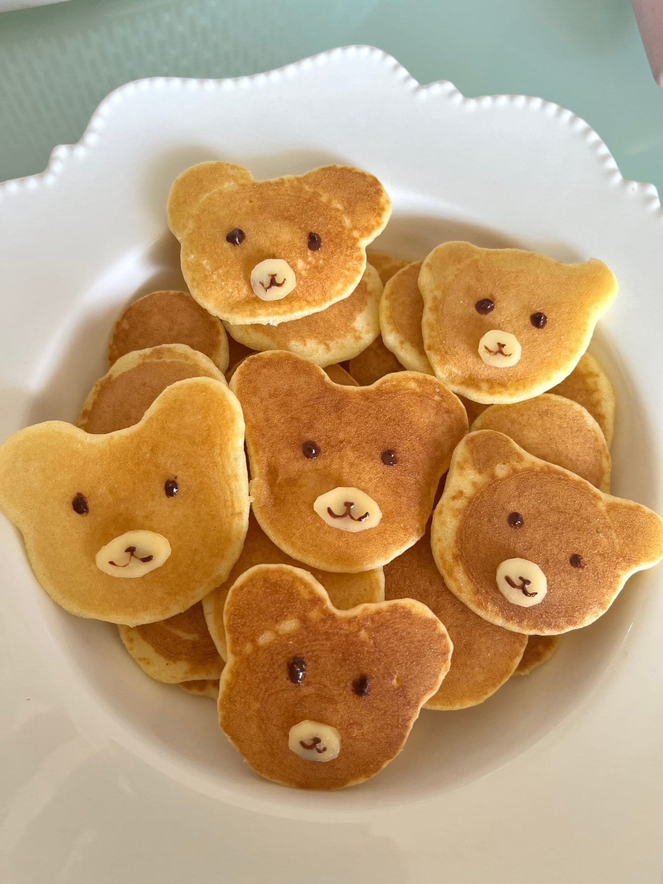 Teddy bear face pancakes on a plate