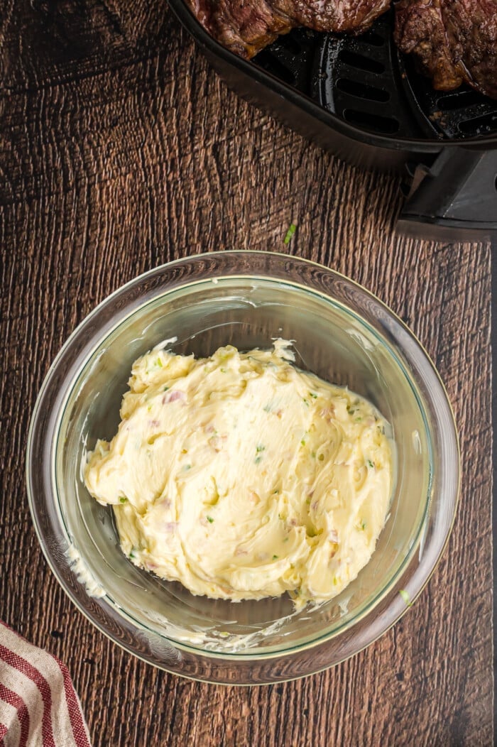 Scallion herb butter in a glass bowl