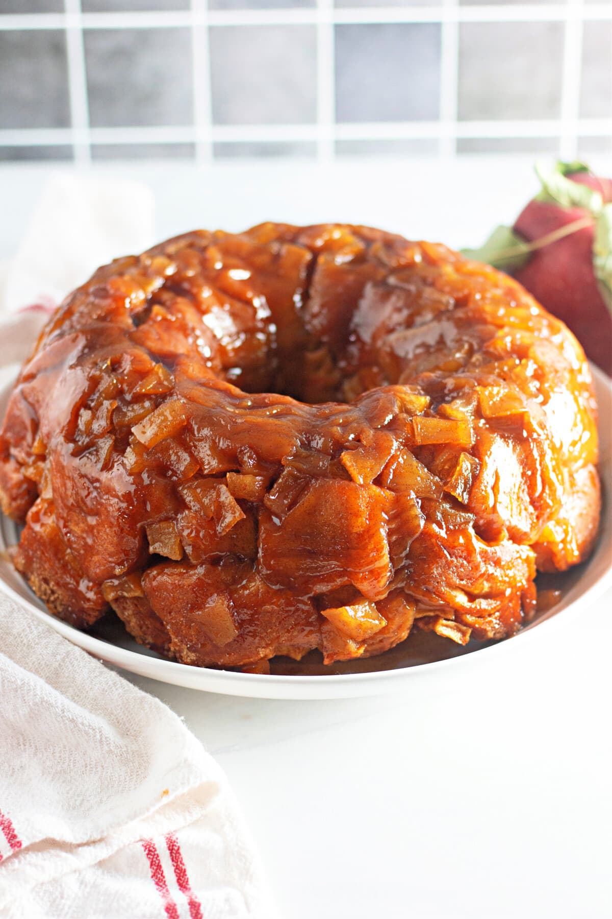 apple fritter monkey bread on a white plate