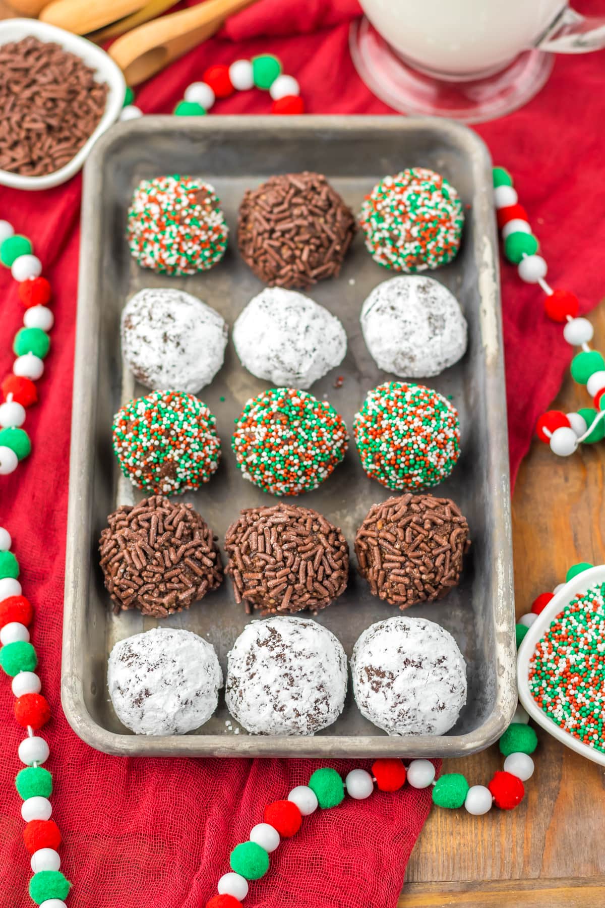 Borbon balls on a baking sheet decorated for Christmas.
