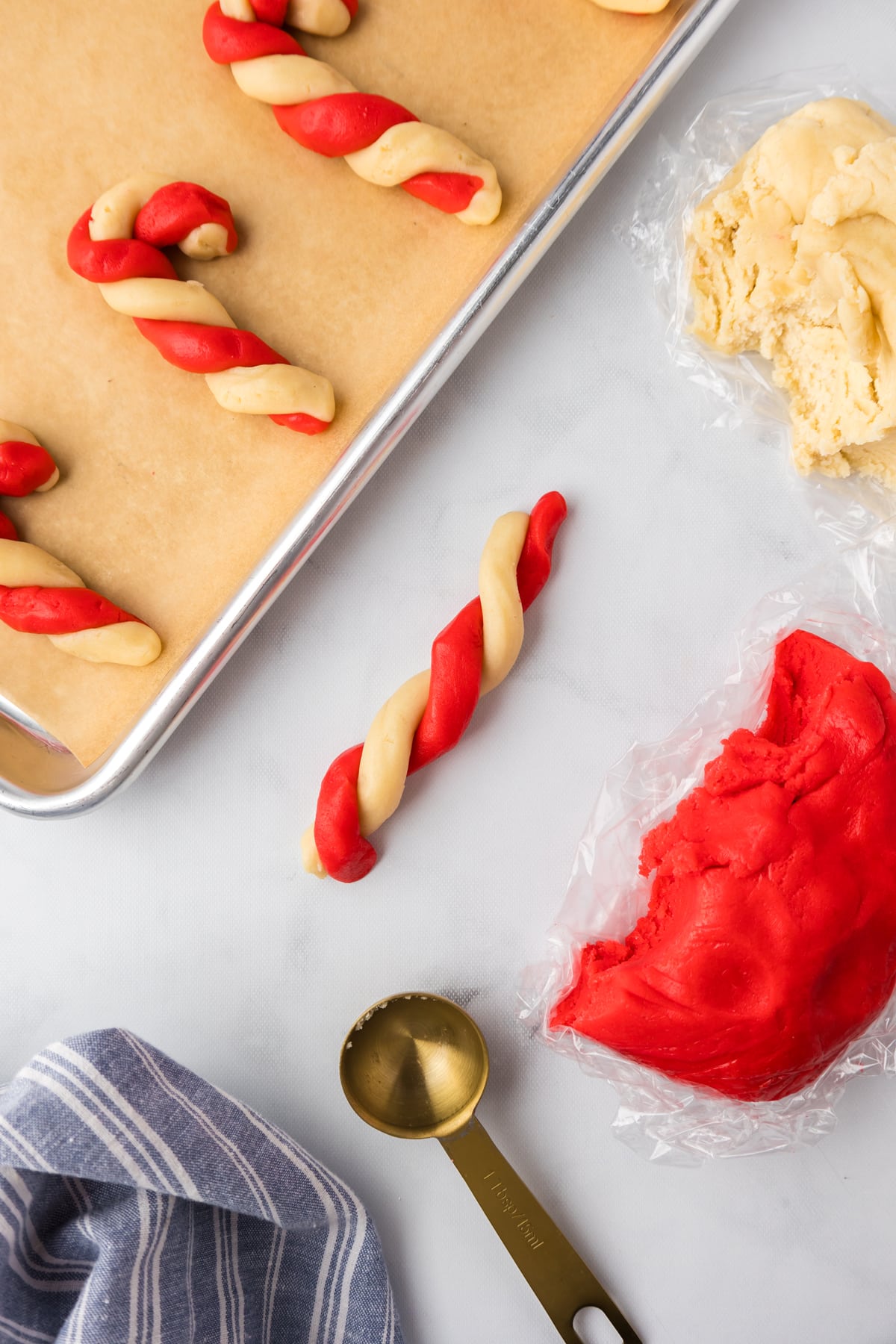 red and white cookie dough twisted together to make cookies.