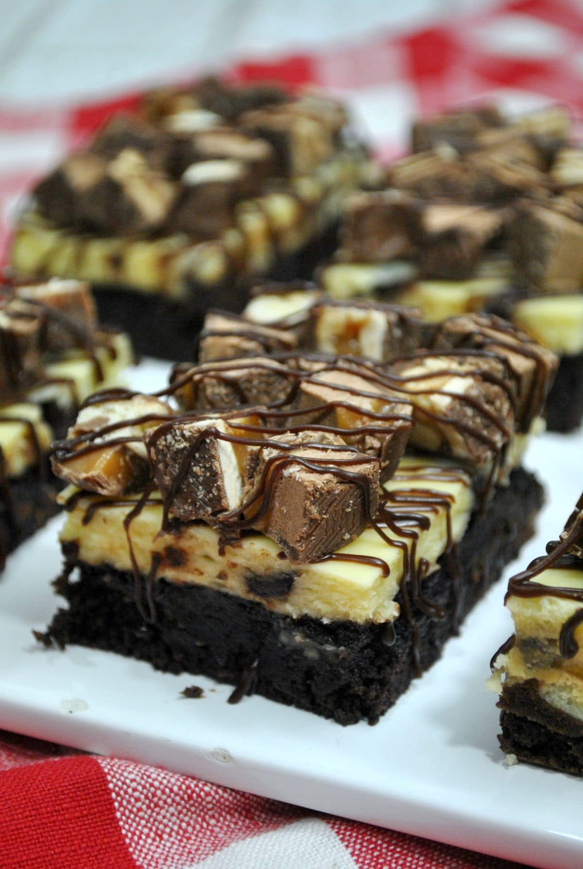 Snickers Cheesecake Brownies on a plate
