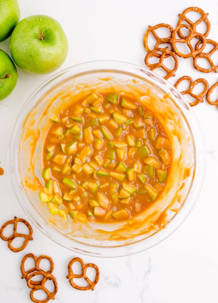 Caramel and apples in a mixing bowl