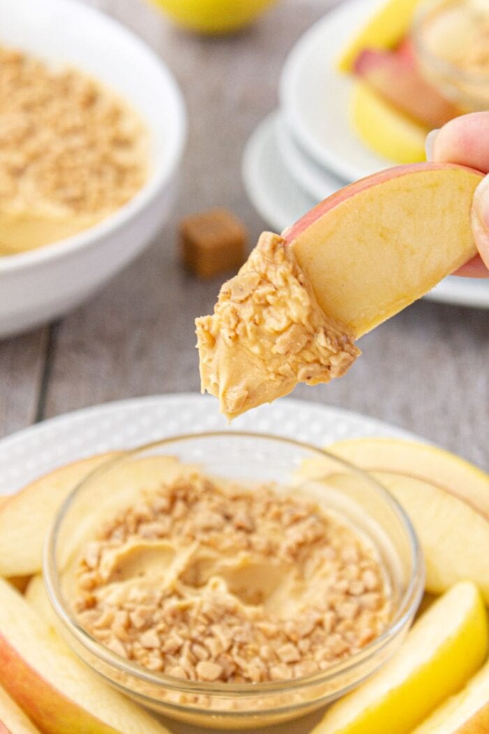 Dipping apple in the caramel dip.