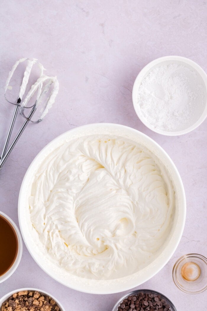 Whipped topping in a white bowl.
