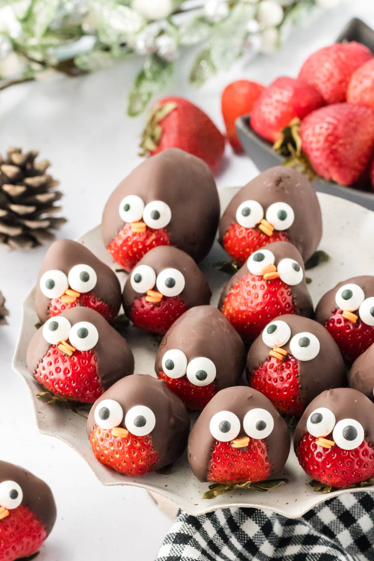 chocolate covered strawberry penguins on a plate
