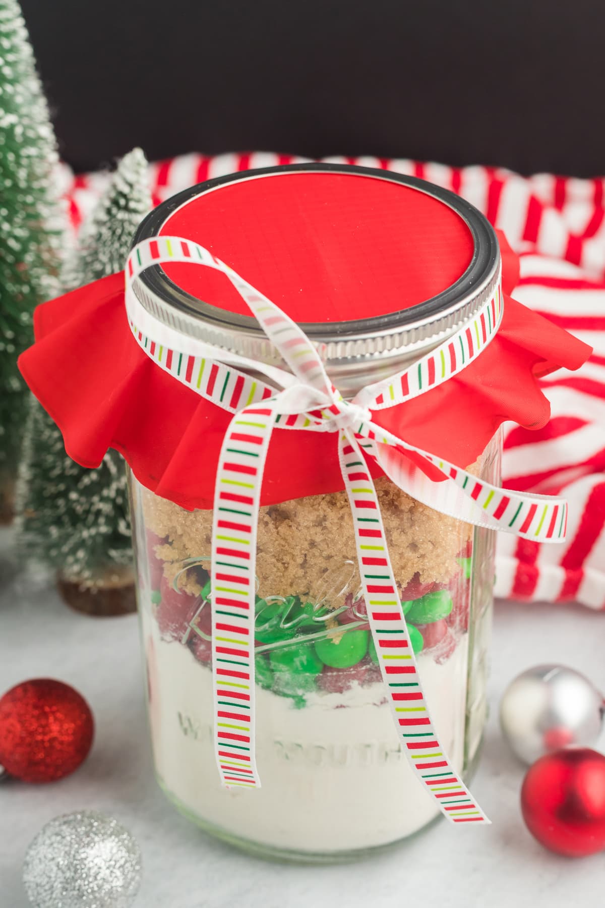 Christmas Cookie mix in a jar ready to give as a gift.