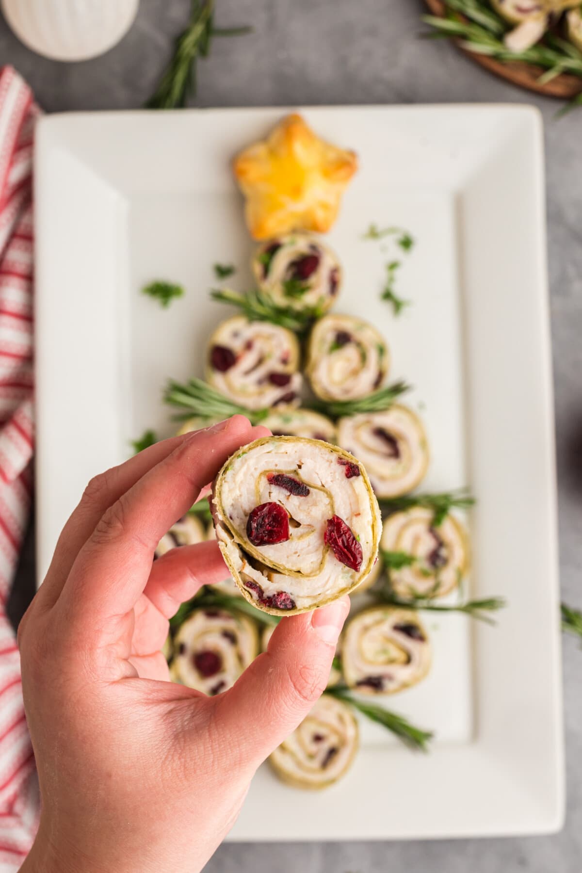 Christmas Tree Appetizer with a pinwheel in a hand