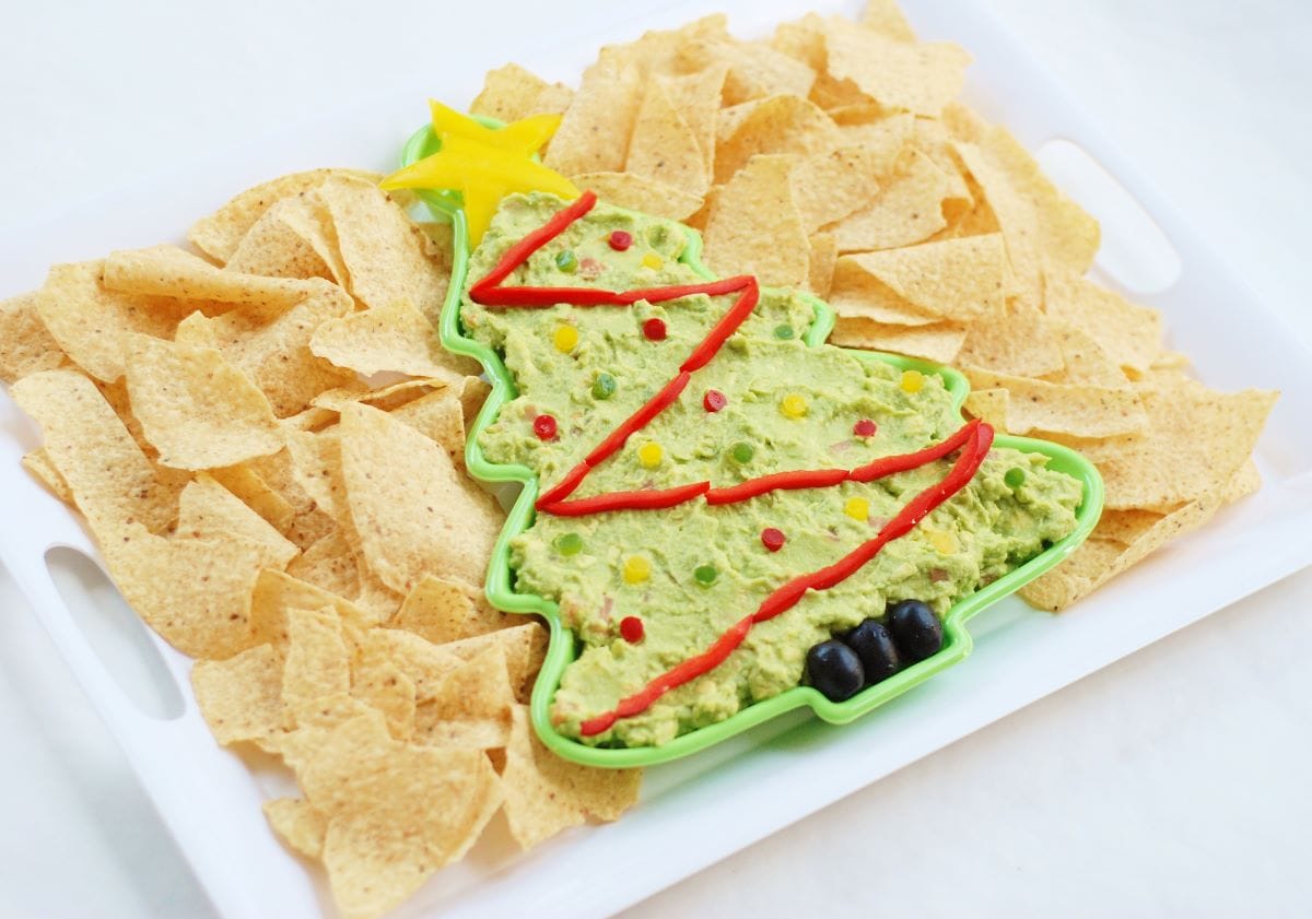 Guacamole Christmas Tree Dip surrounded by tortilla chips