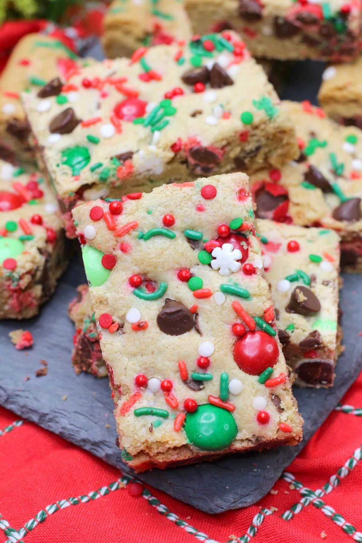 Christmas Cookie Bars on a gray slate serving platter.
