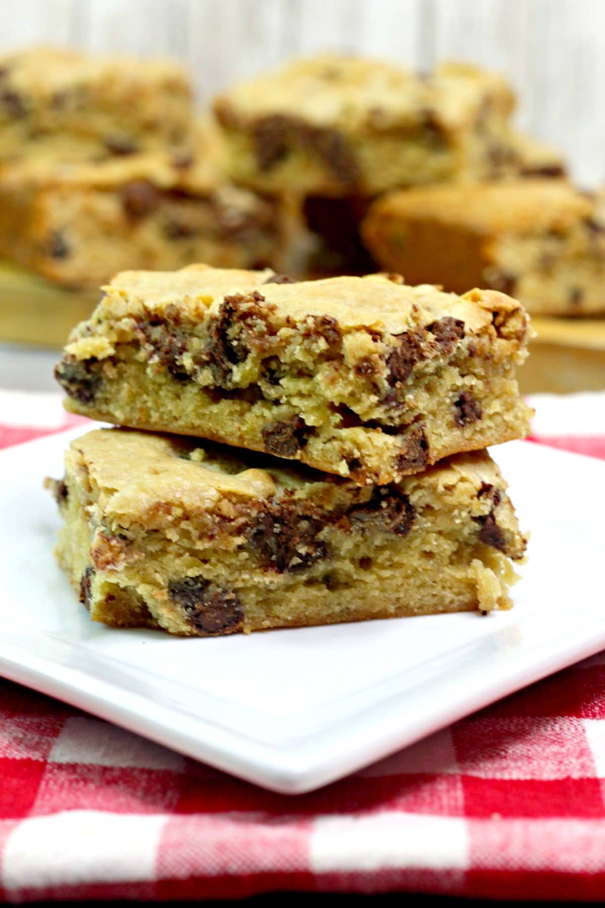 two banana chocolate chip blondie  brownies on a plate