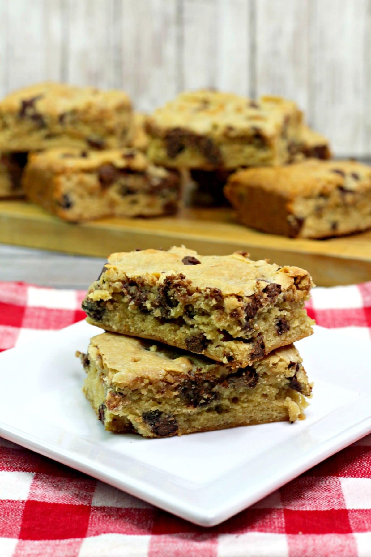 two banana chocolate chip blondie  brownies on a plate