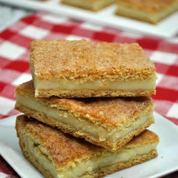 churro cheesecake bars on a plate