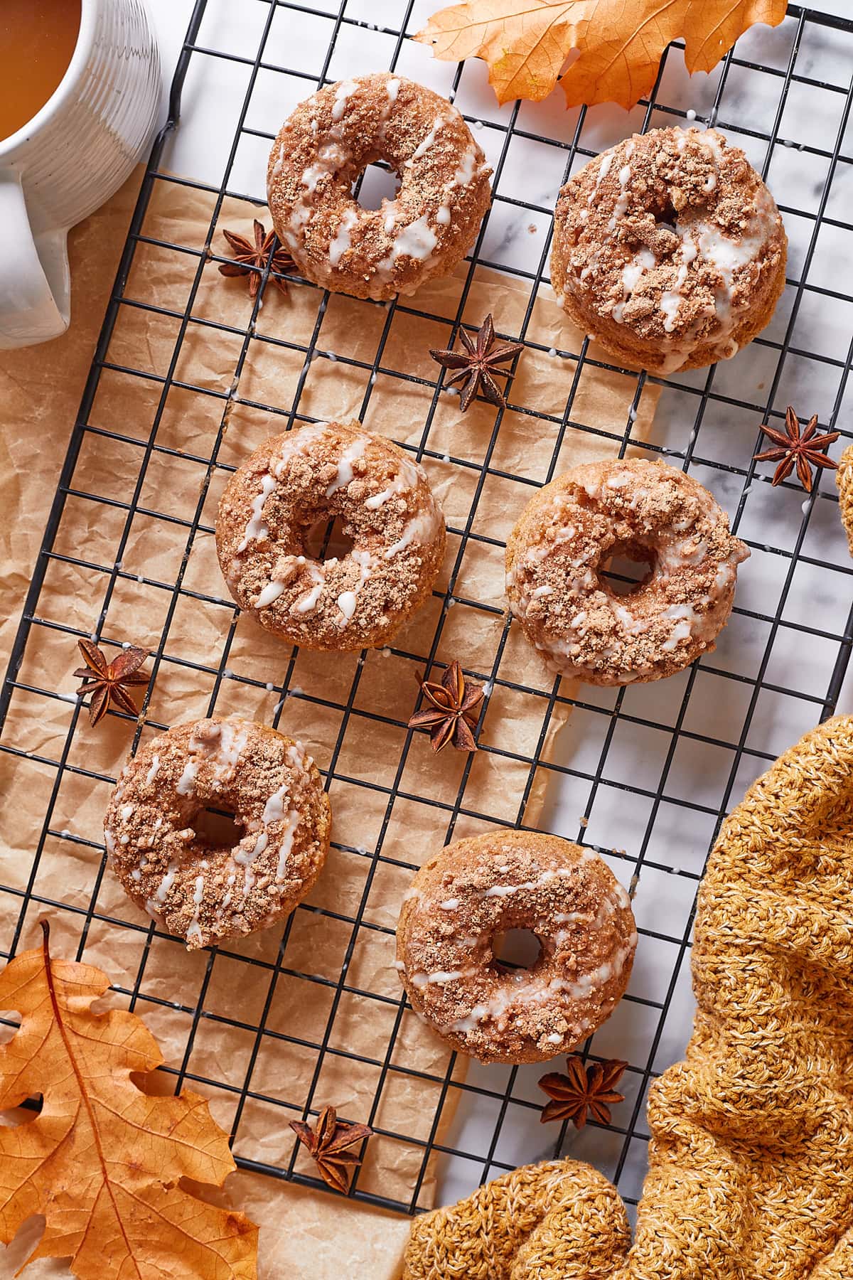 Cinnamon donuts on a fall themed backgound.