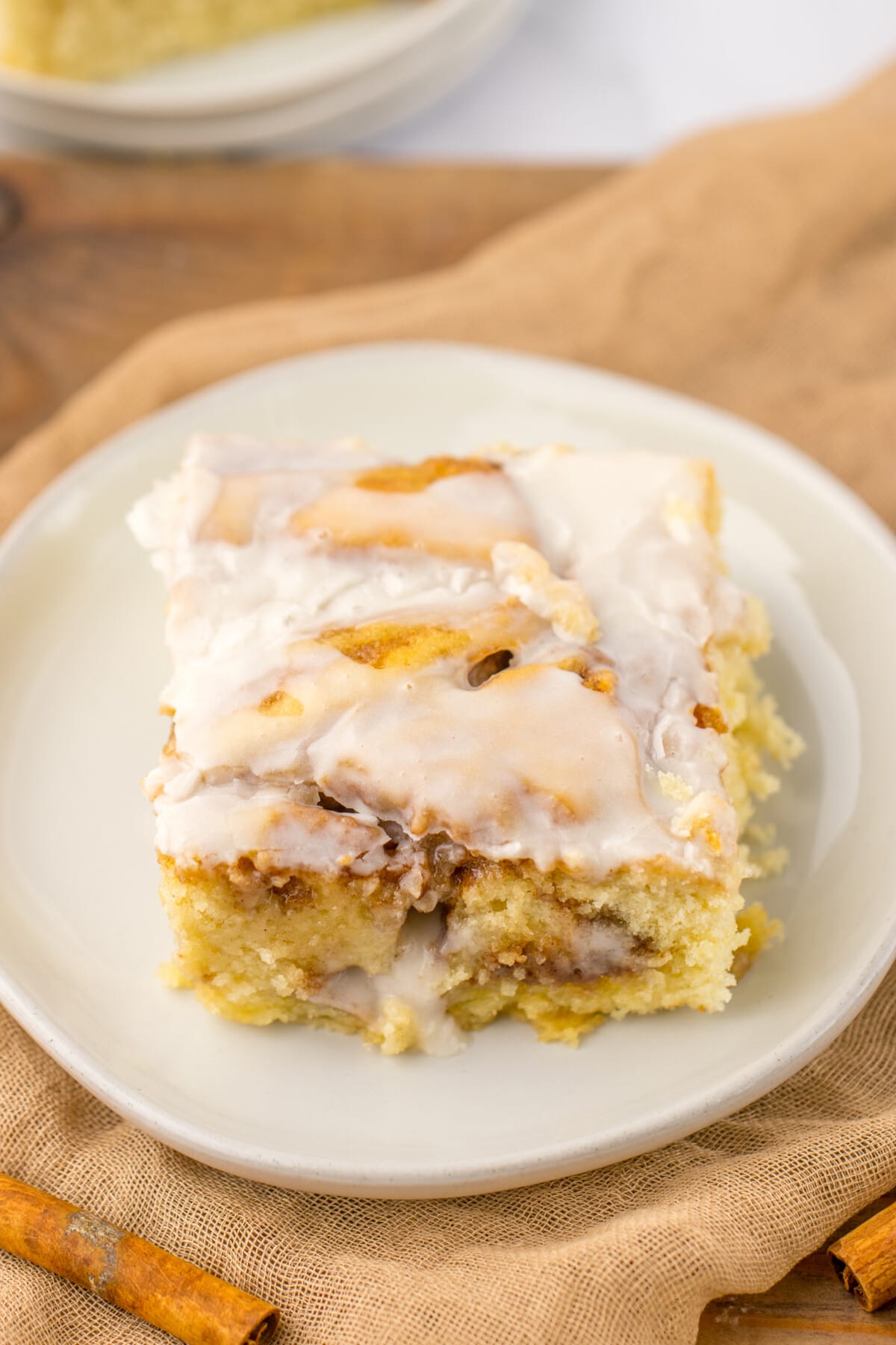 cinnamon roll cake on a white plate