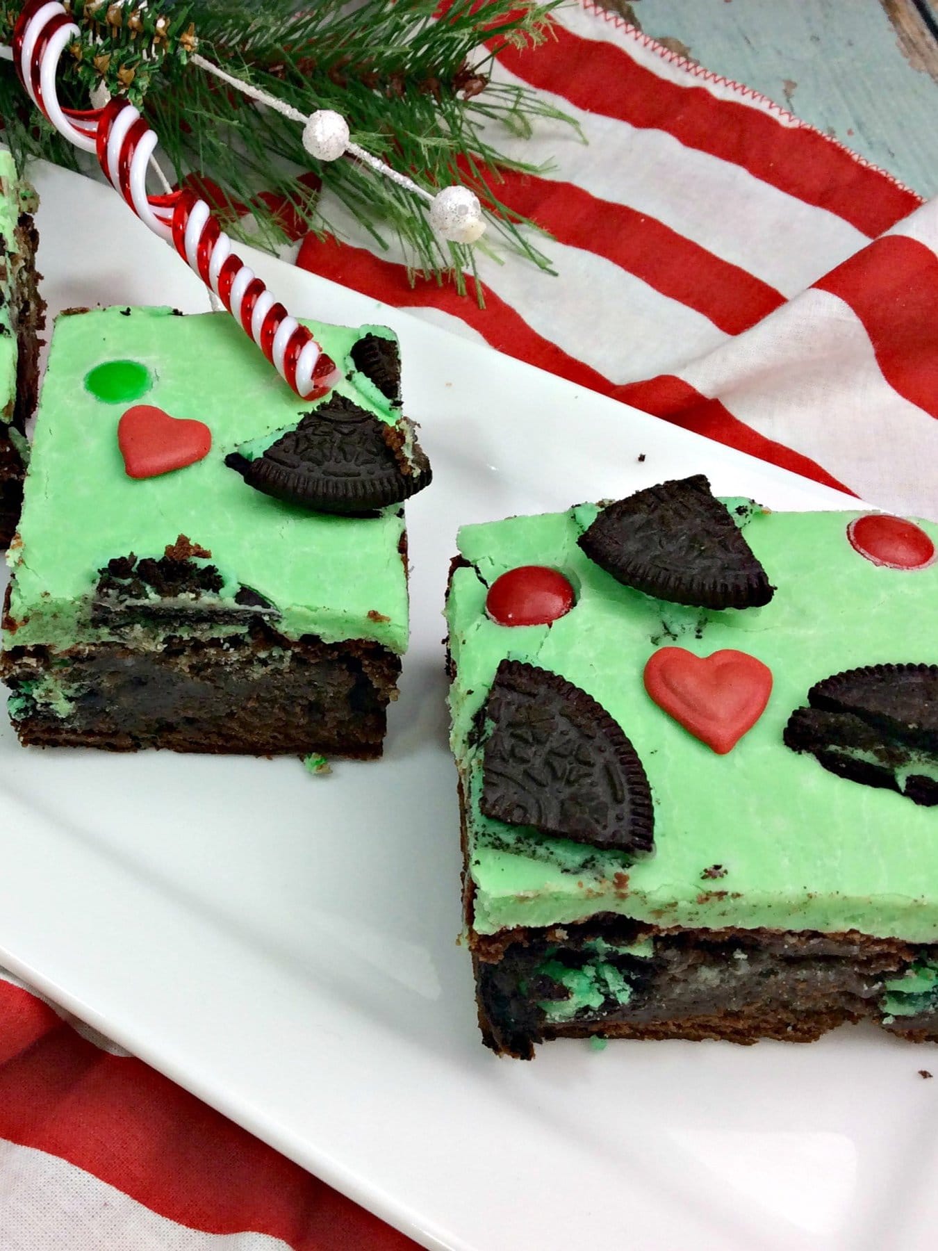 two grinch brownies on a platter