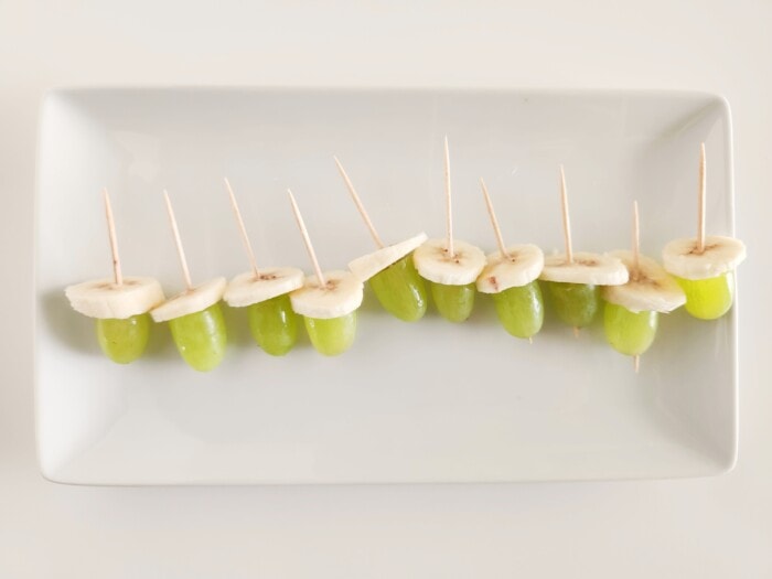 bananas and grapes on a stick