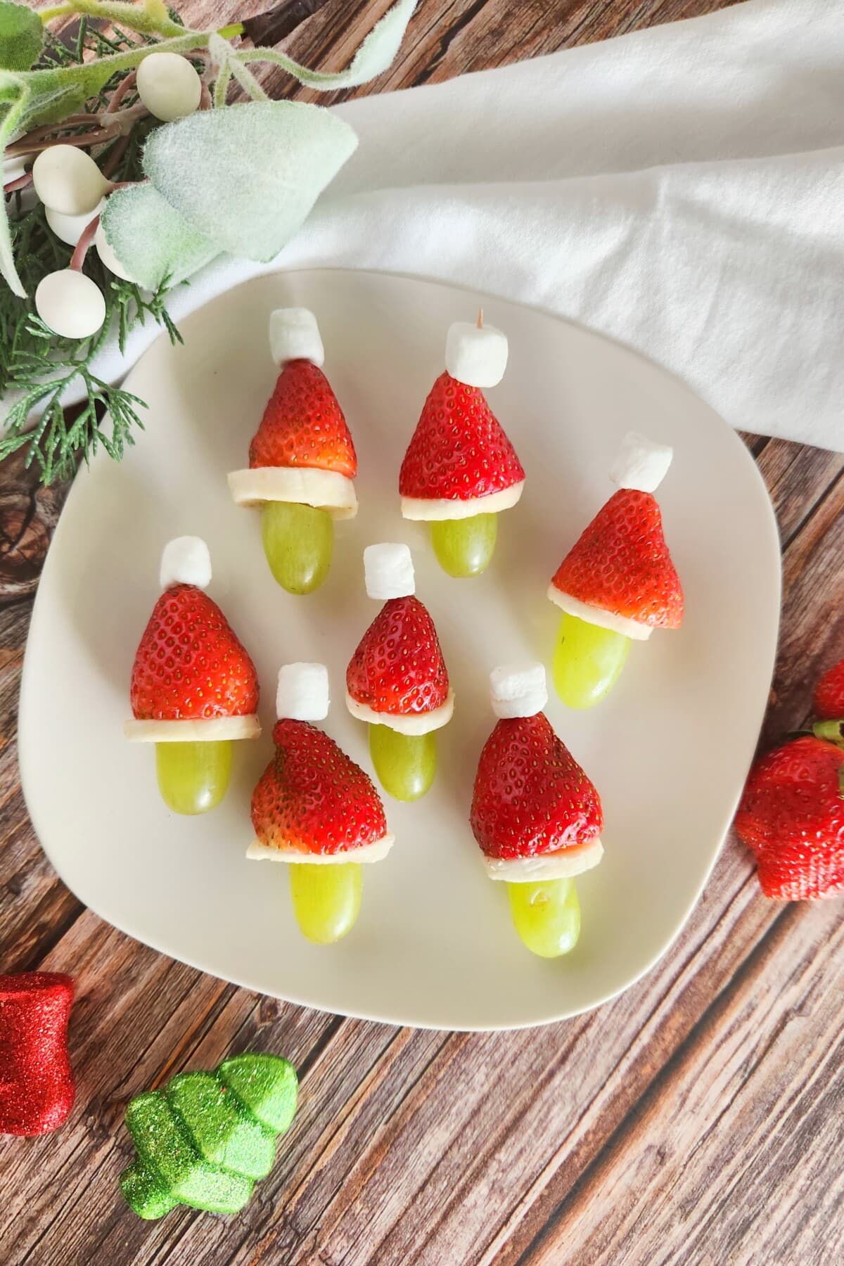 Grinch Fruit Kabob on a white plate