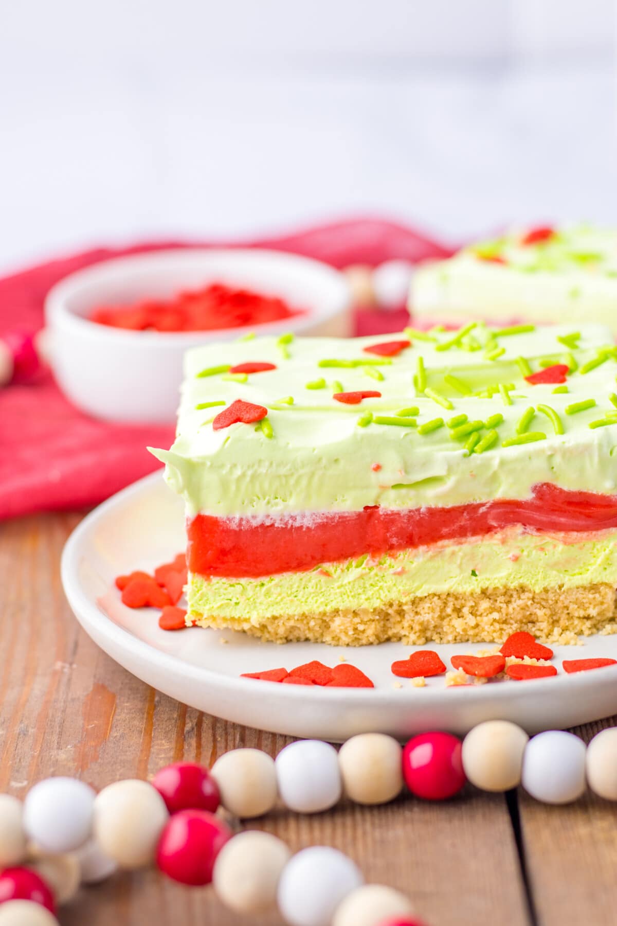 grinch cheesecake lush on a white plate
