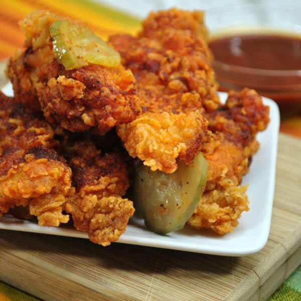 Nashville Chicken with Pickles on a white plate