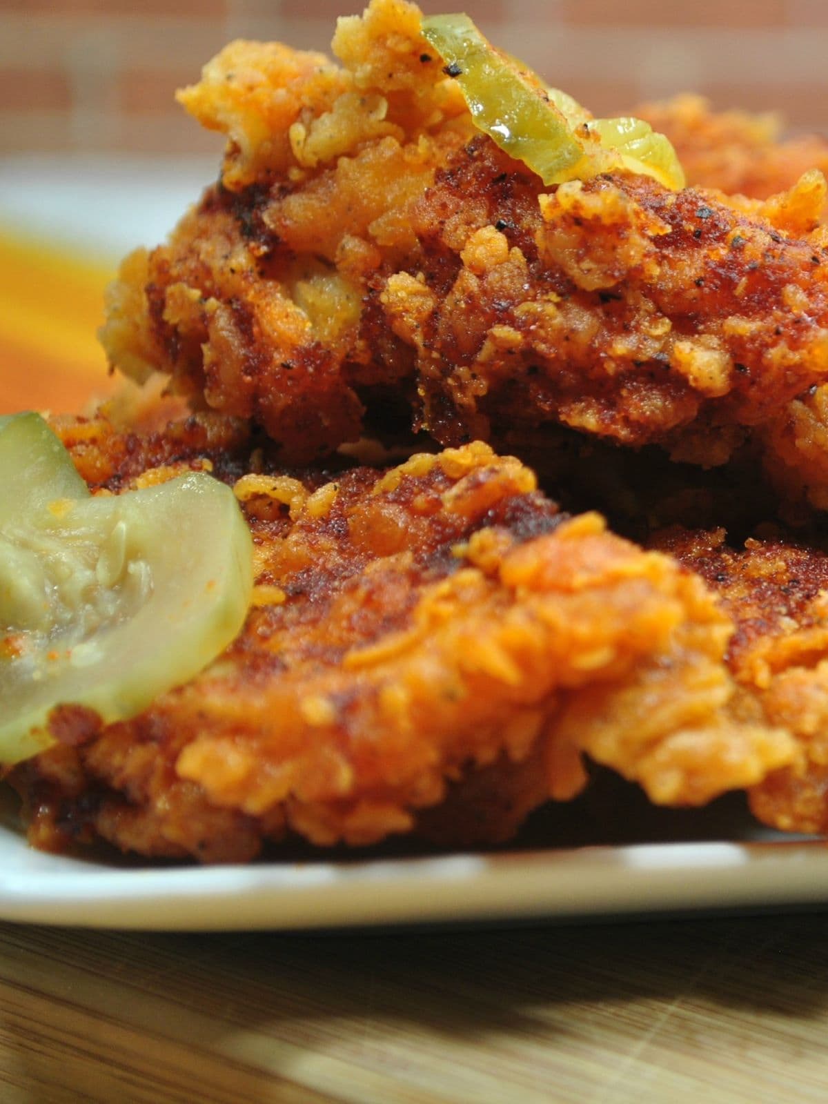 Nashville Chicken with Pickles on a white plate