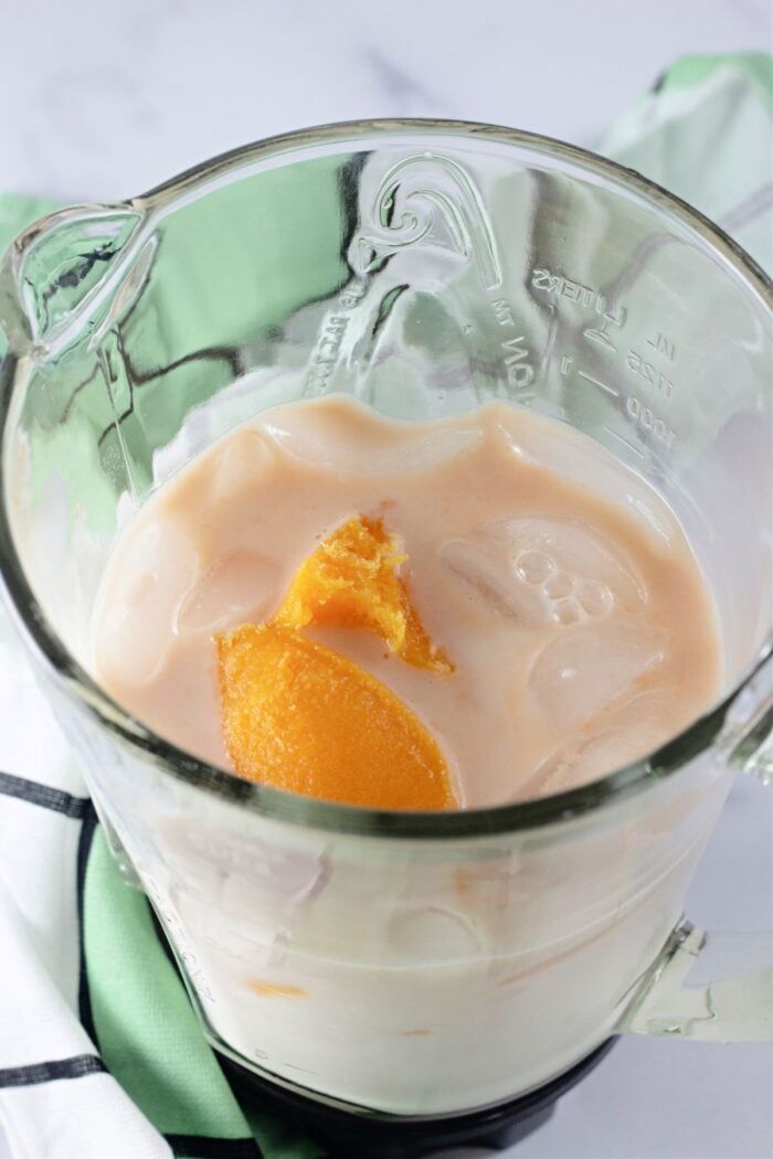milk, ice, juice concentrate, and vanilla in a blender.