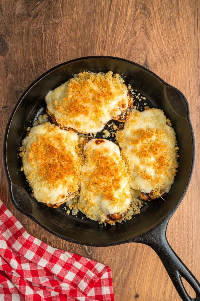 Longhorn parmesan crusted chicken in a cast iron skillet