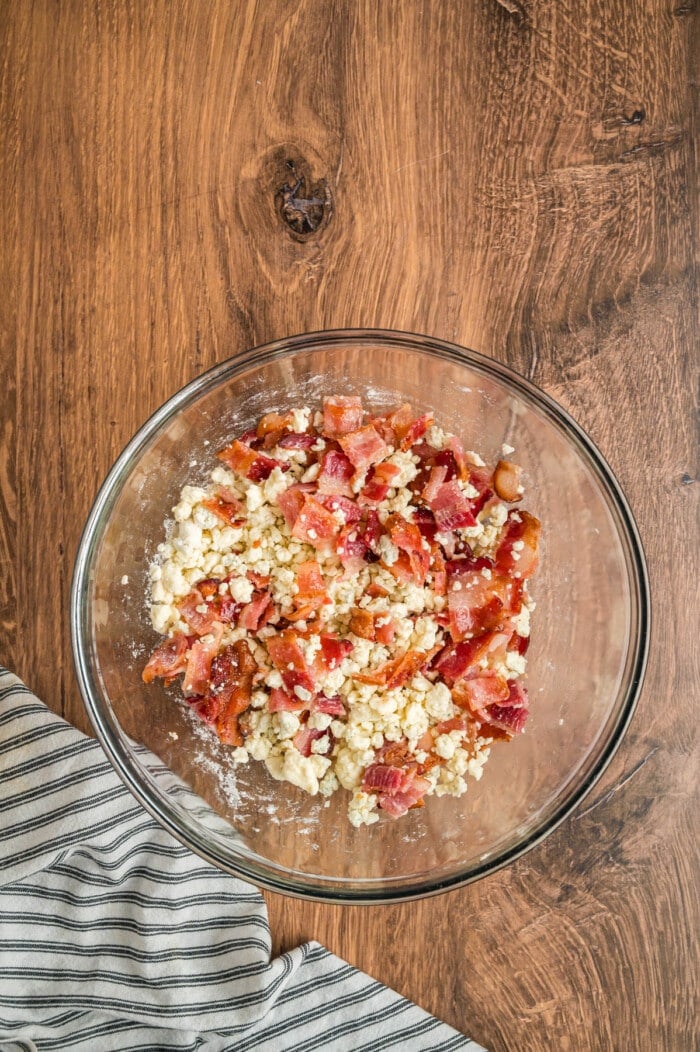 Bacon and blue cheese crumbles in a glass bowl