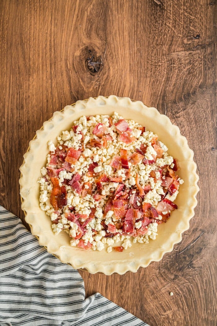 Bacon and blue cheese crumbles in a pie crust