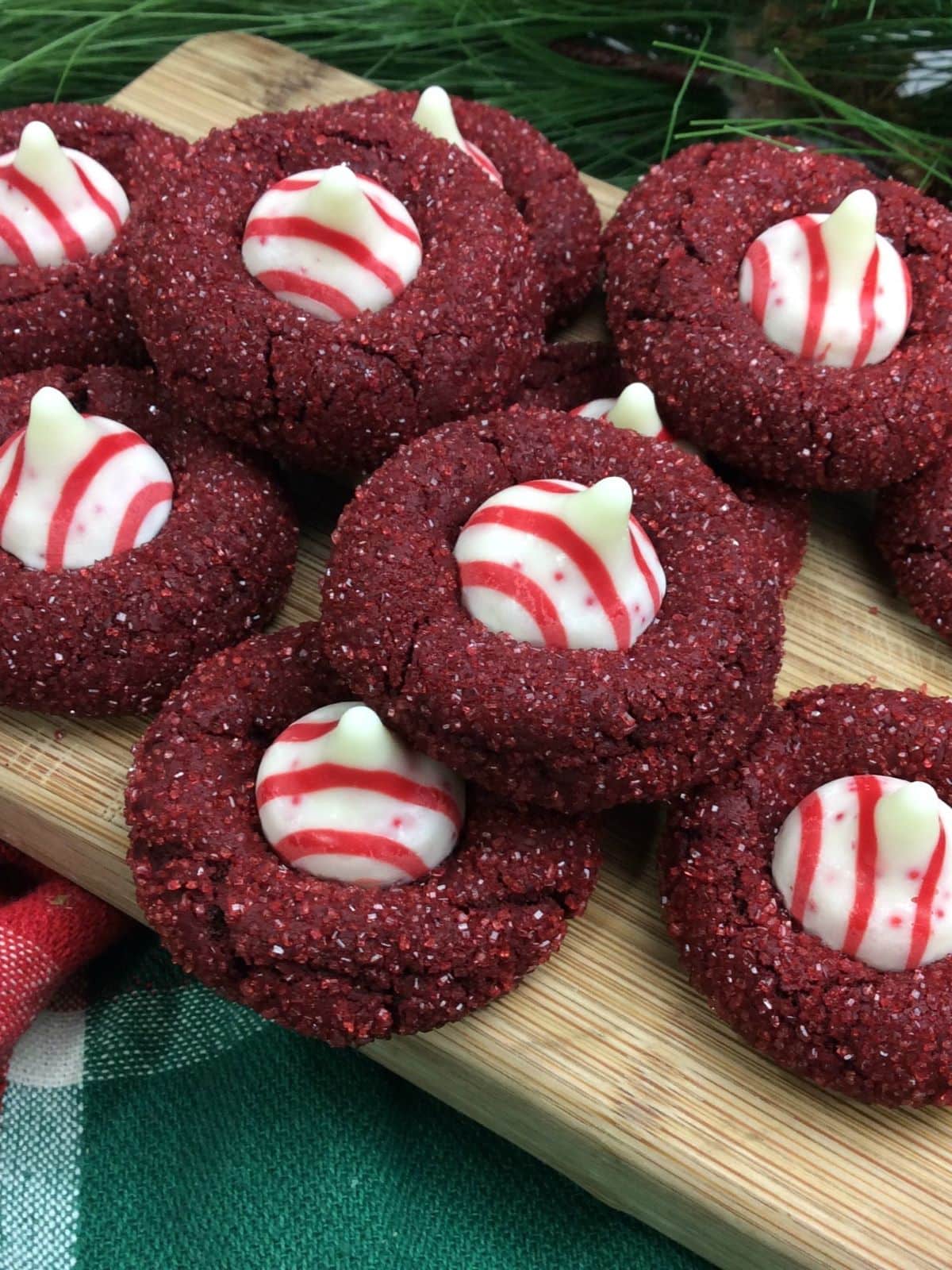 red velvet cookies on a wooden cutting board