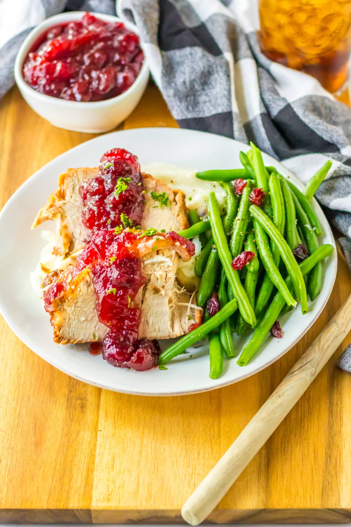 slow cooker cranberry pork loin on a white plate