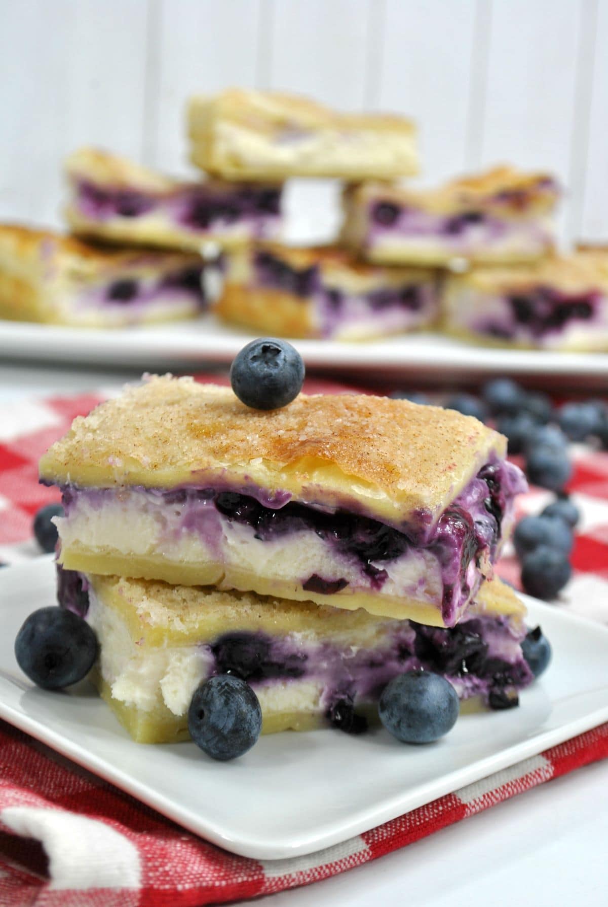 Sopapilla Blueberry Cheesecake Bars on a plate