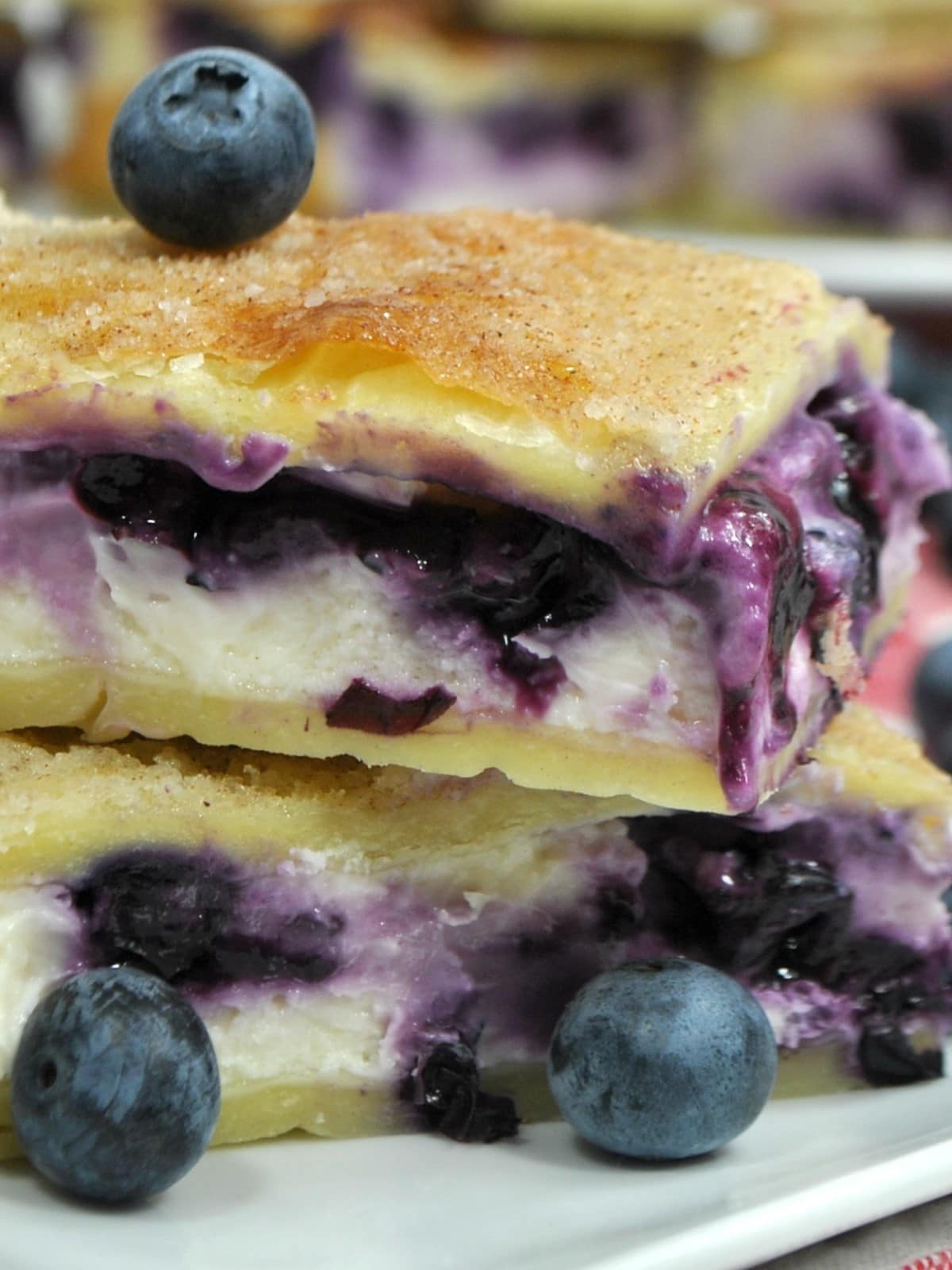 Sopapilla Blueberry Cheesecake Bars on a plate