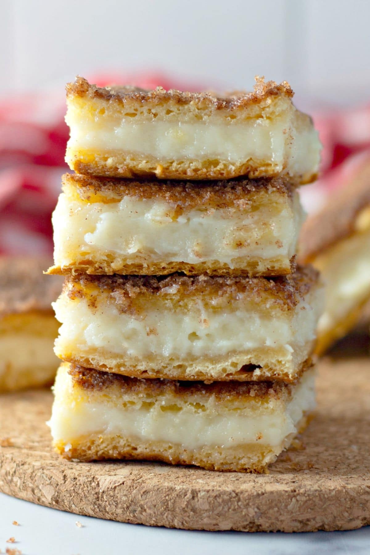 close up of a stack of sopapilla cheesecake bars