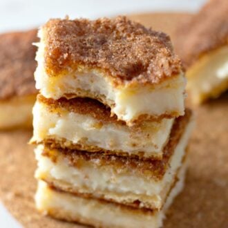 a stack of sopapilla cheesecake bars