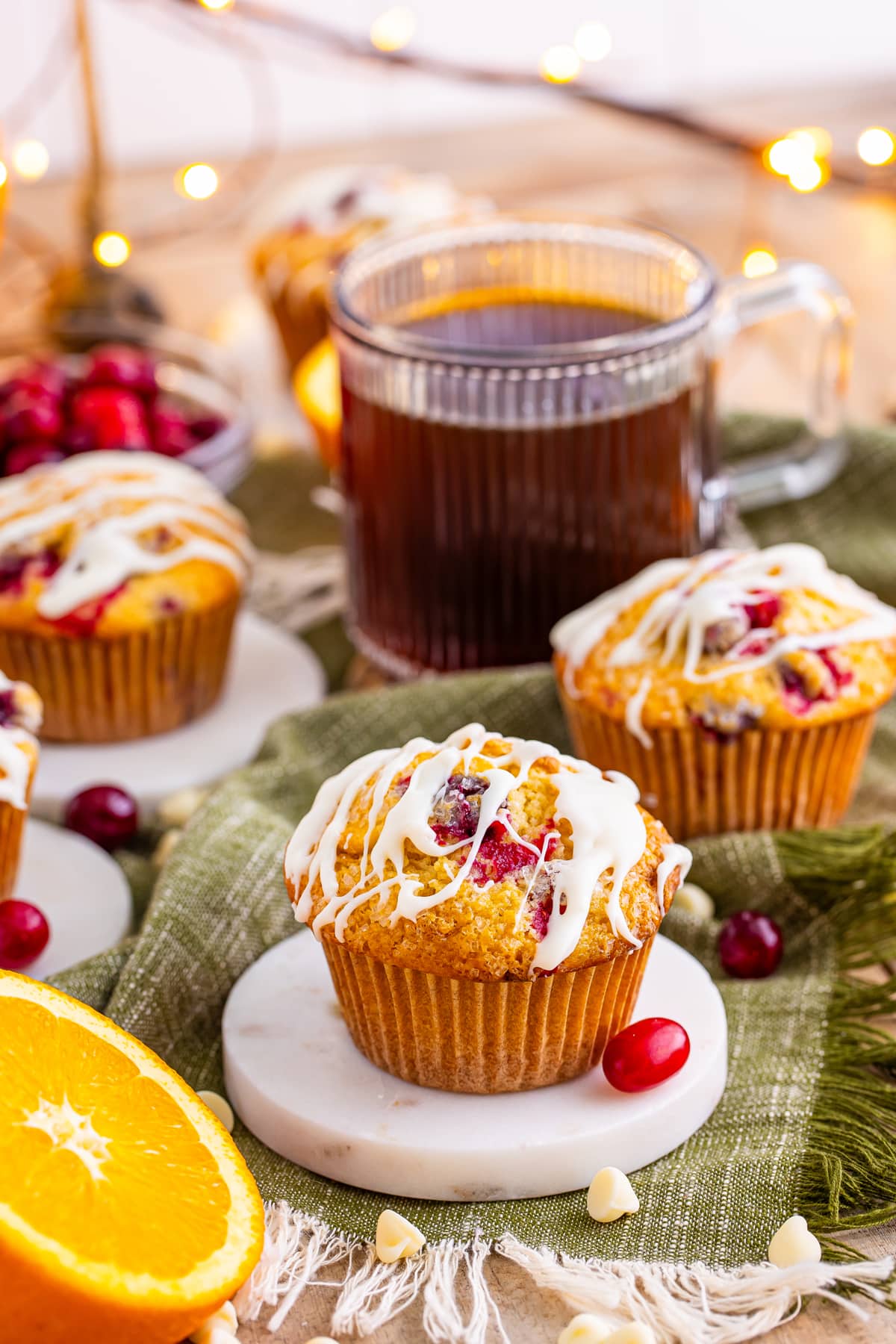 Muffins served with hot tea.