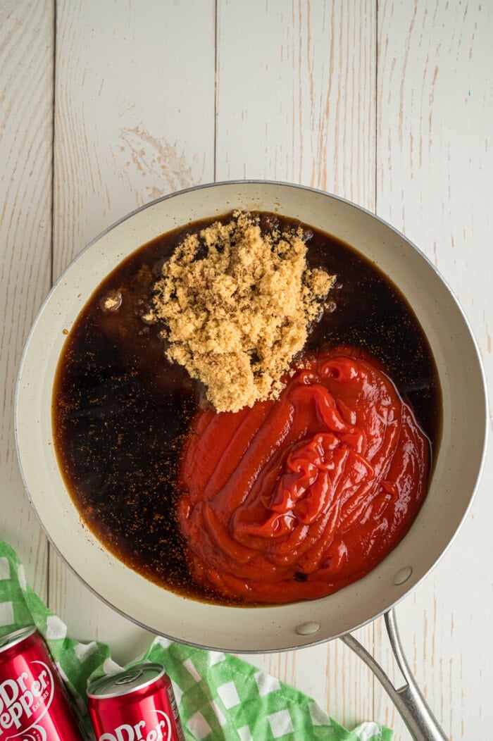 Dr Pepper, ketchup, and brown sugar in a sauce pan