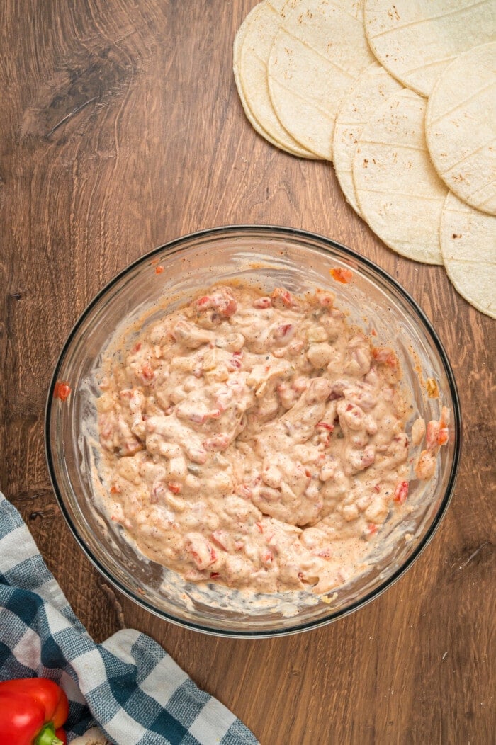 Creamy chicken mixture in a clear bowl.