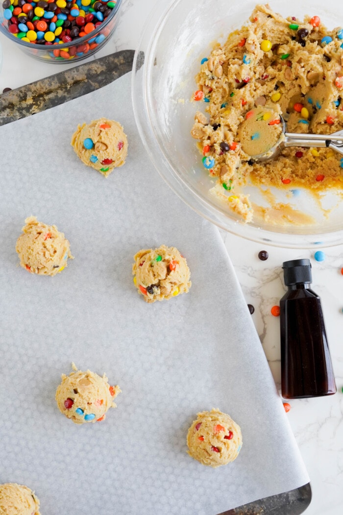 Cookie batter scooped onto a baking sheet.