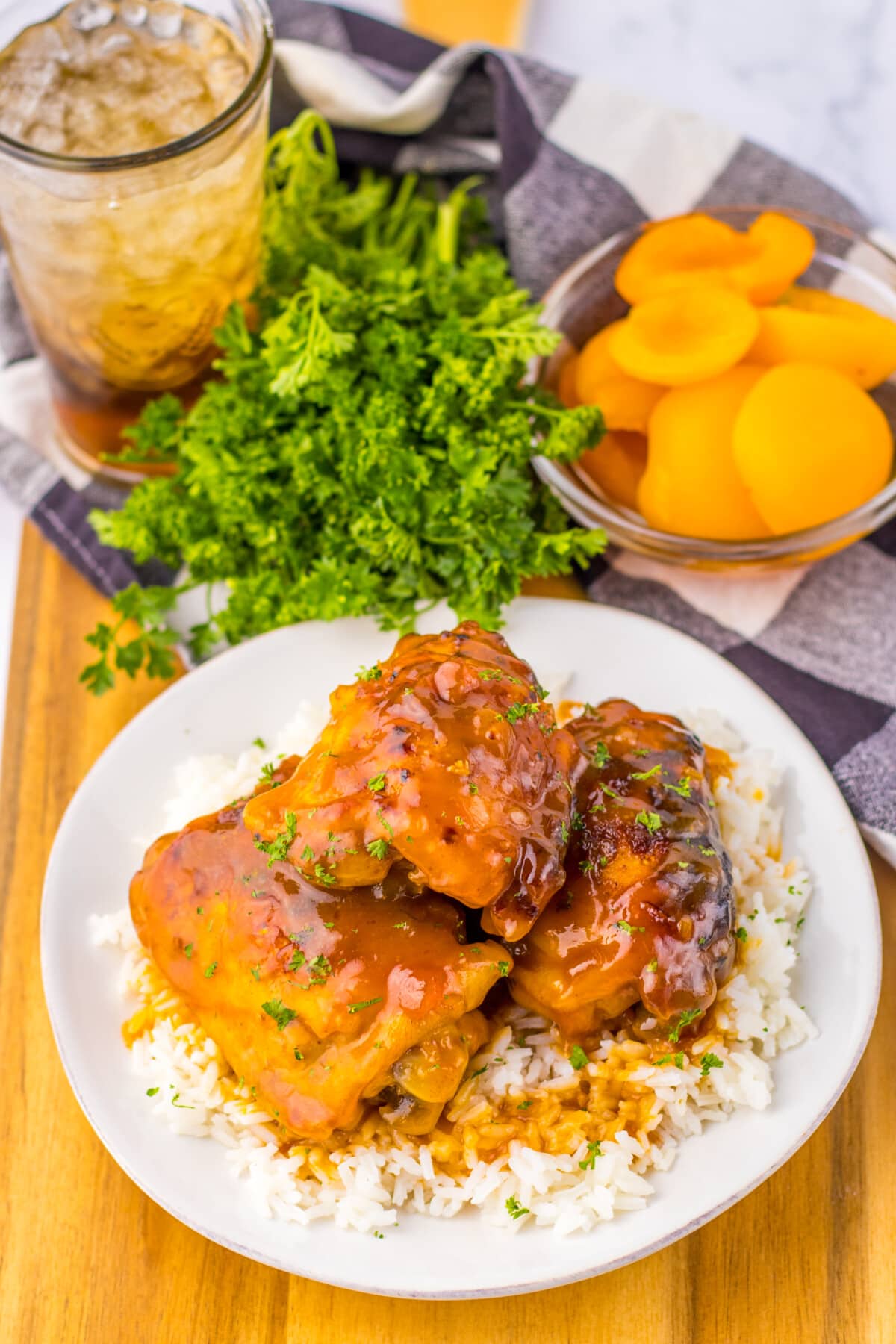 slow cooker apricot chicken on a white plate