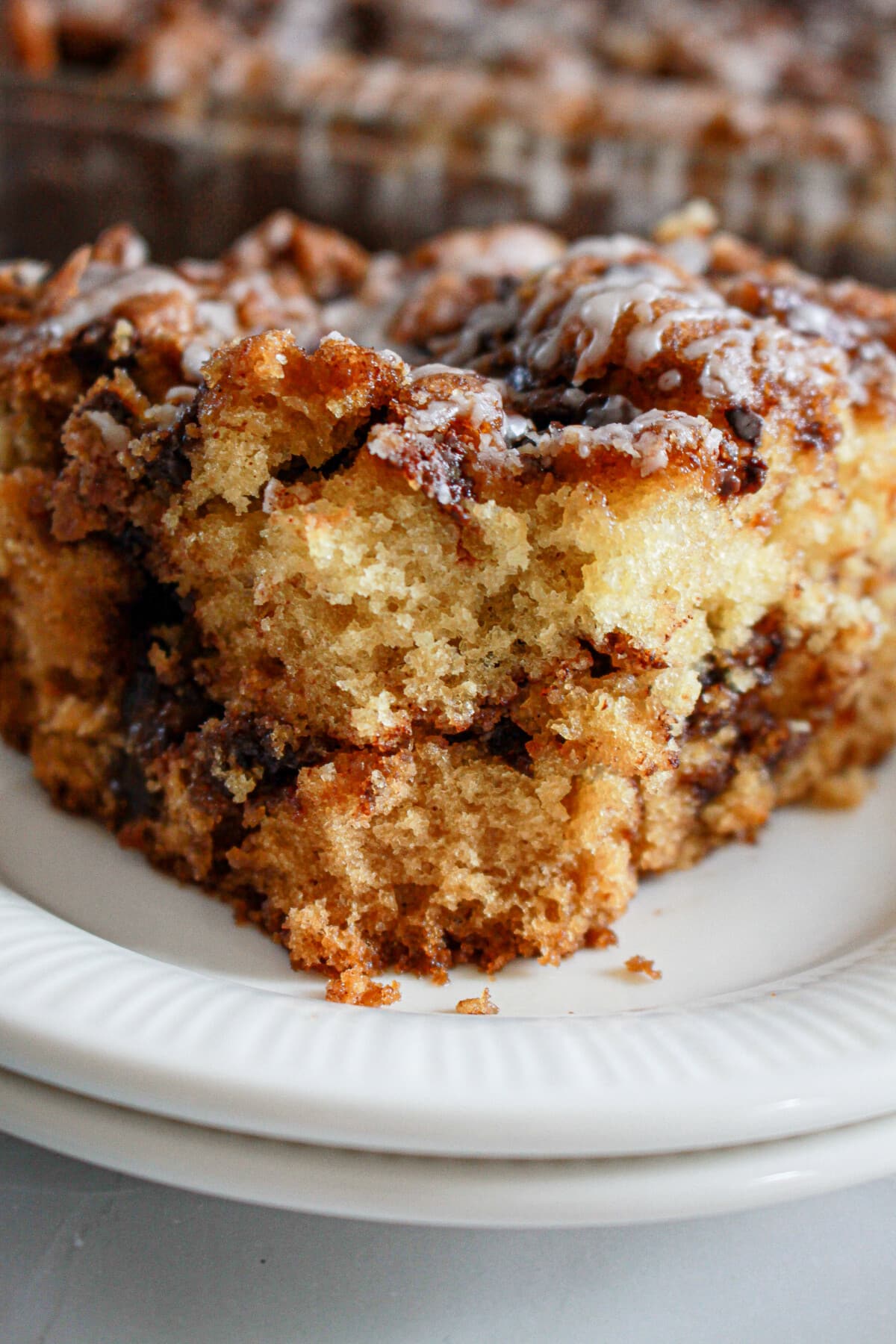 chocolate chip coffee cake on a white plate