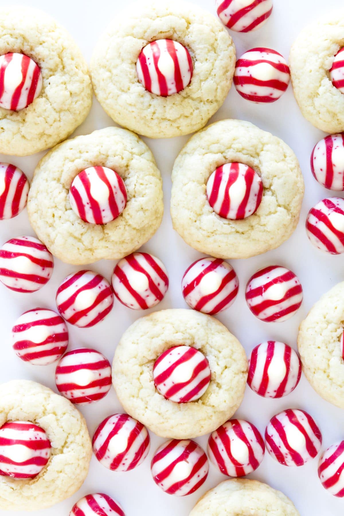 candy cane kisses and peppermint kiss cookies on a white counter