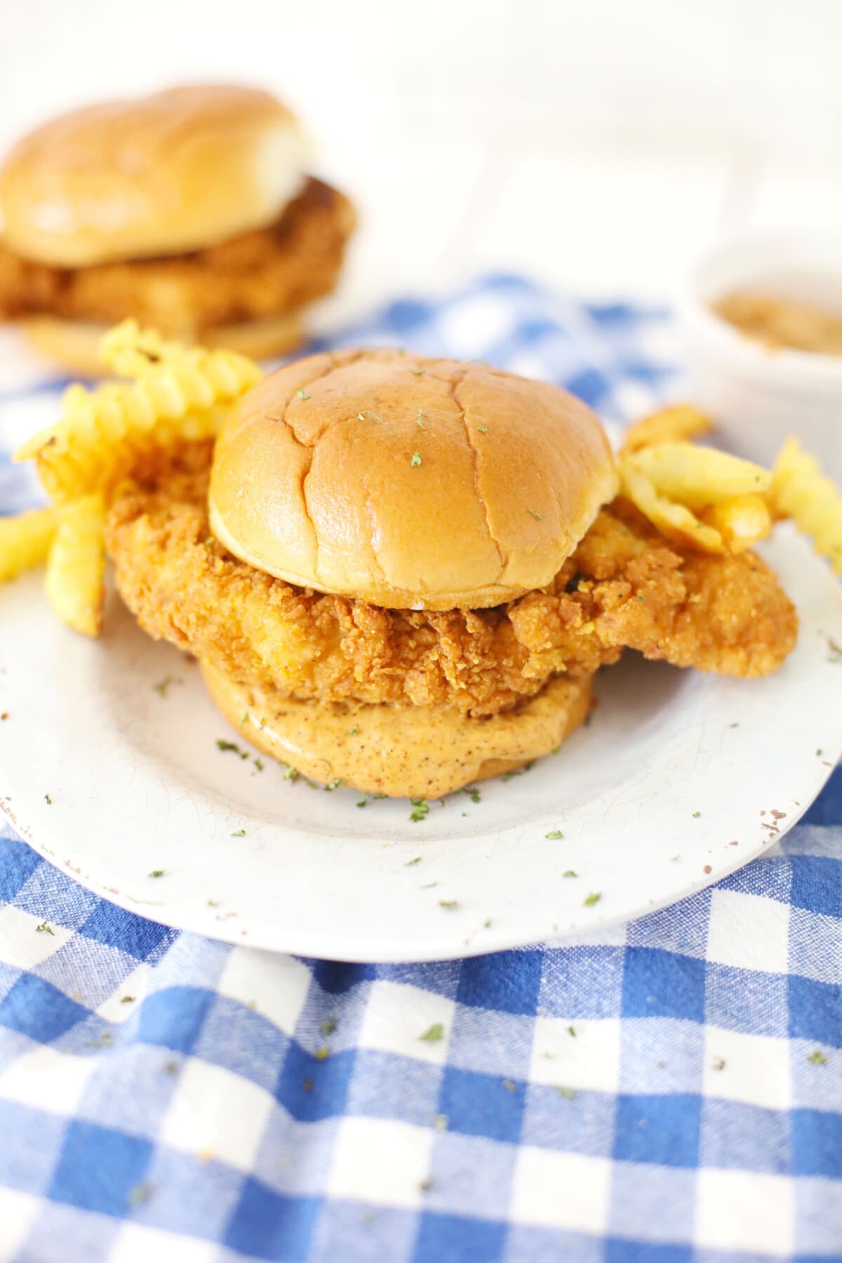 Top view of fried chicken sandwich on a plate