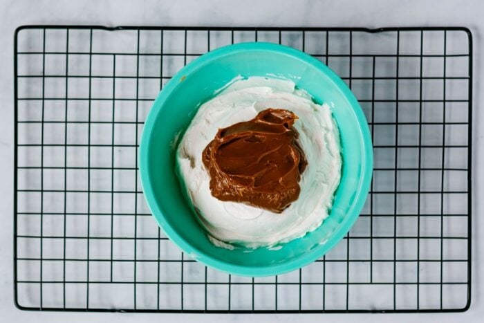 vanilla frosting with caramel in a bowl