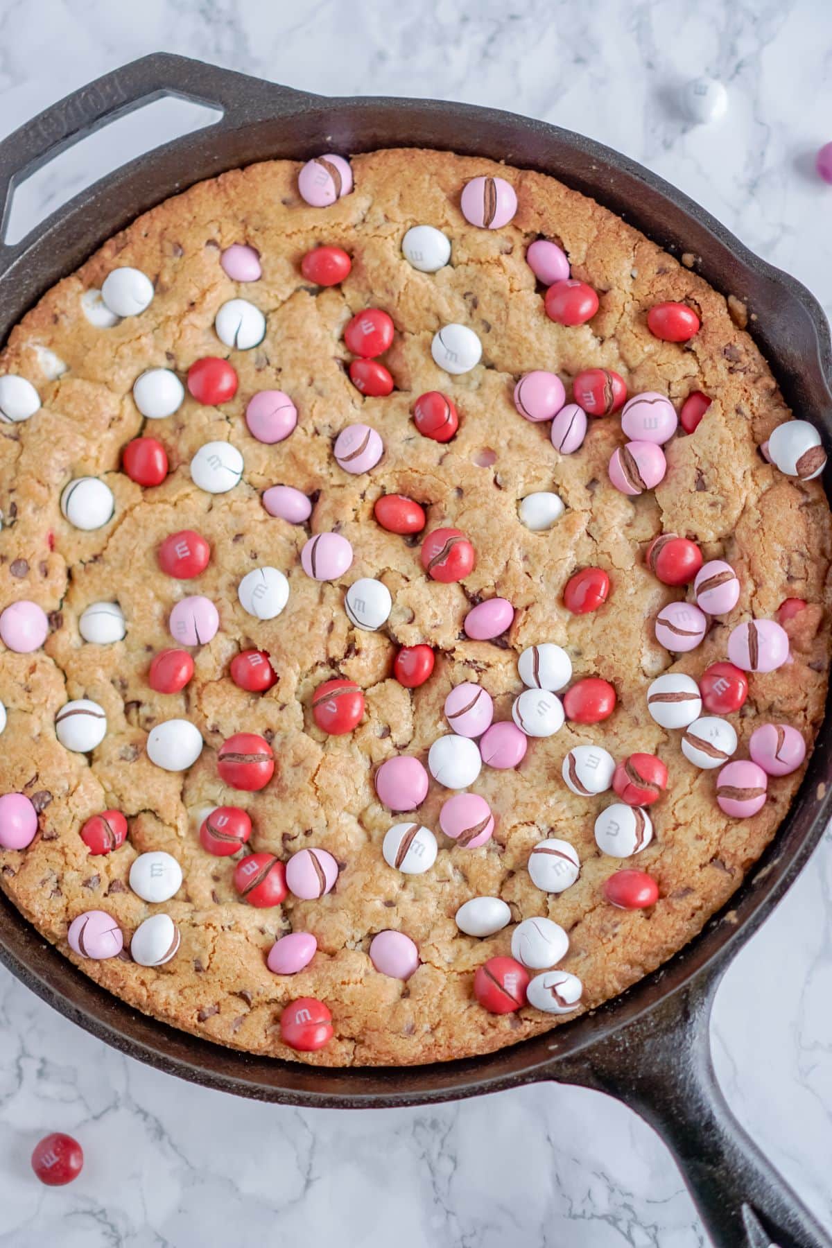 baked Valentine's Day skillet cookie with candies on top