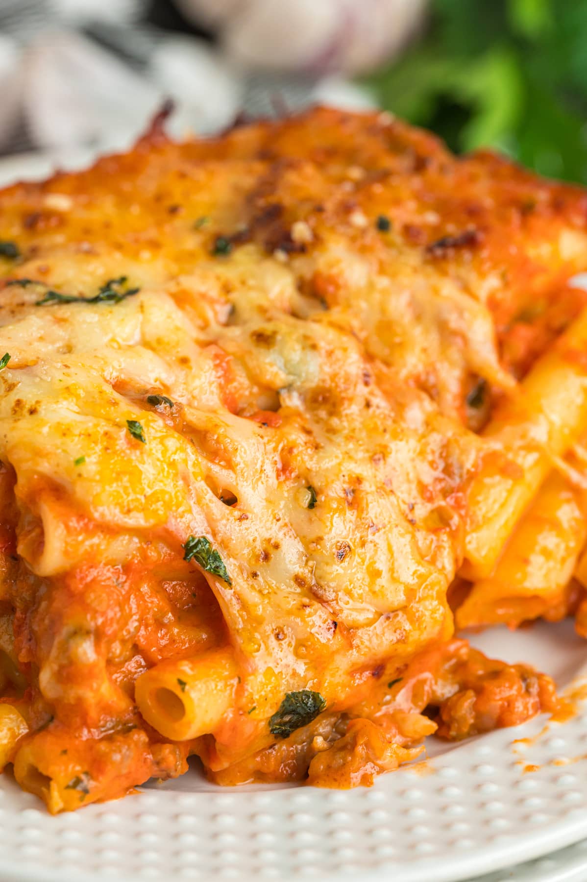 A serving of baked ziti on a plate