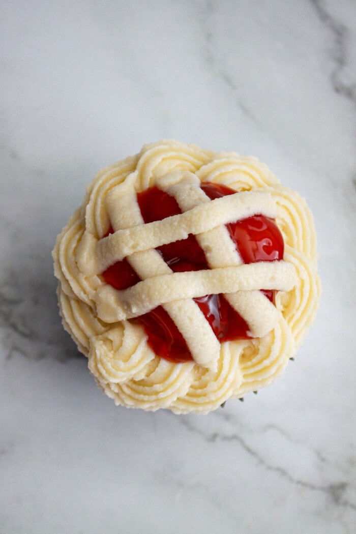 piping on cherry pie cupcakes