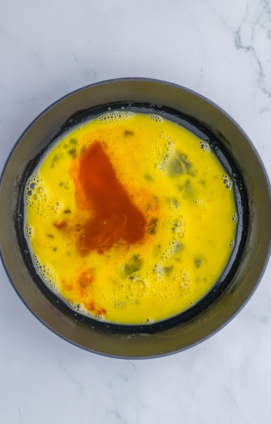 eggs and hot sauce in bowl